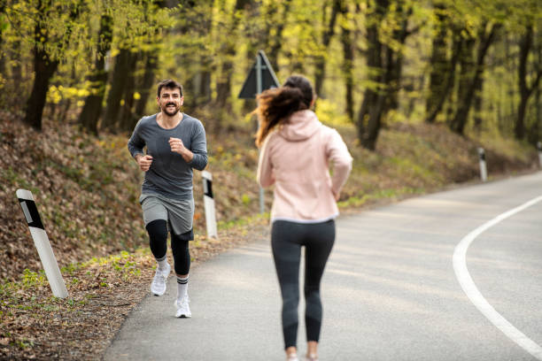 istock Happy young athletes run through nature 1390351970
