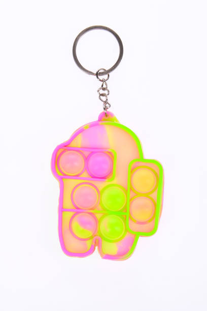 istock Pop it silicone rainbow anti-stress toy isolated on white background. Simple dimple. 1390353330