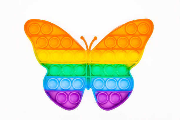 istock Pop it silicone rainbow anti-stress toy isolated on white background. Simple dimple. 1390353422