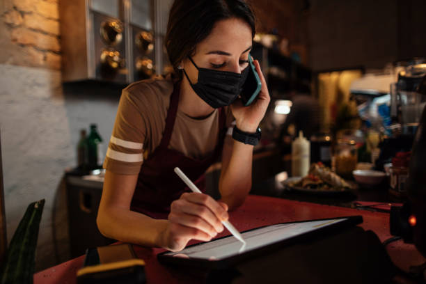 istock Receiving food order over phone 1390362780