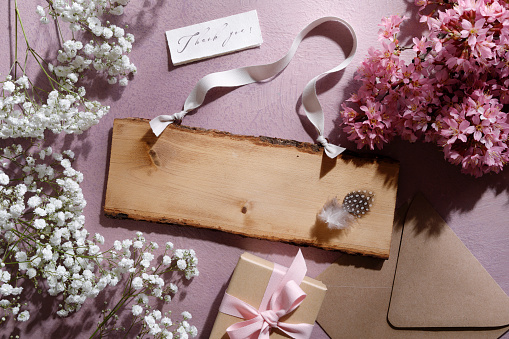 Rustic wooden wedding sign with fowers.