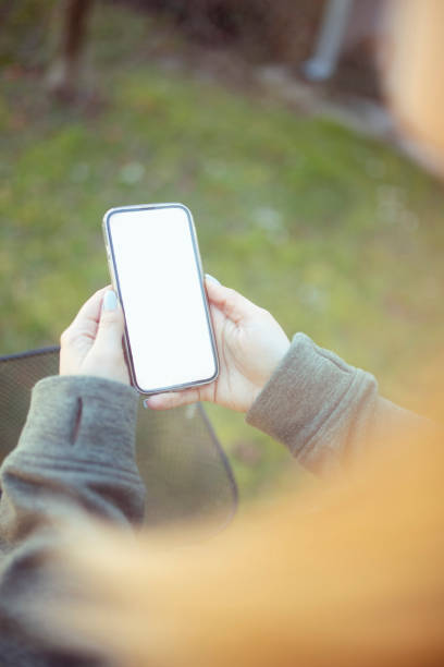 istock An unrecognizable woman types a text message. Close-up. 1390378261