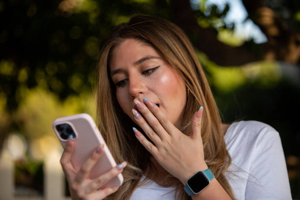 istock Woman using her mobile device in an outdoor environment. 1390384685