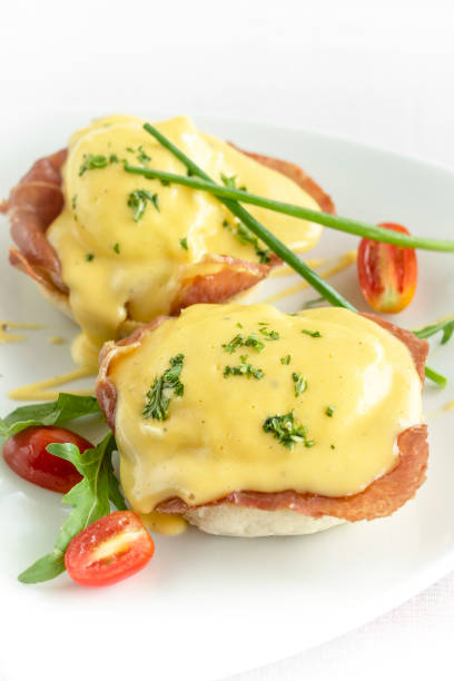 istock eggs benedict breakfast with ham and hollandaise sauce 1390387020