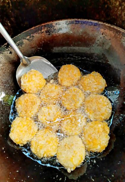 istock Frying Shrimp Cake in cooking pan - food preparation. 1390404086