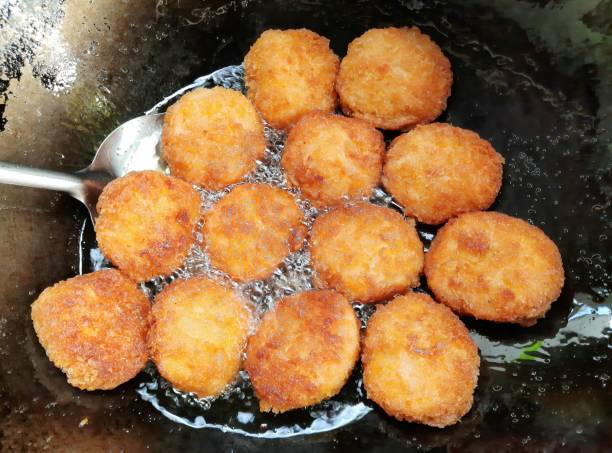 istock Frying Shrimp Cake in cooking pan - food preparation. 1390404102