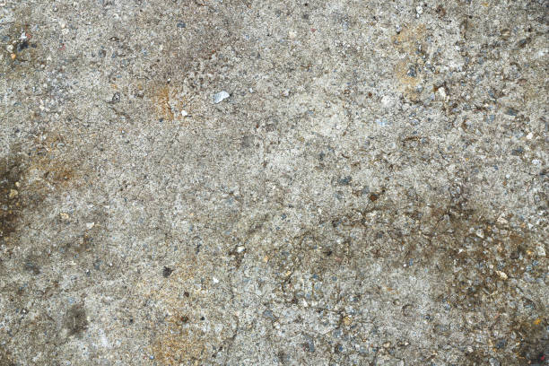 istock Old gray concrete wall close-up - texture. Industrial background 1390404918