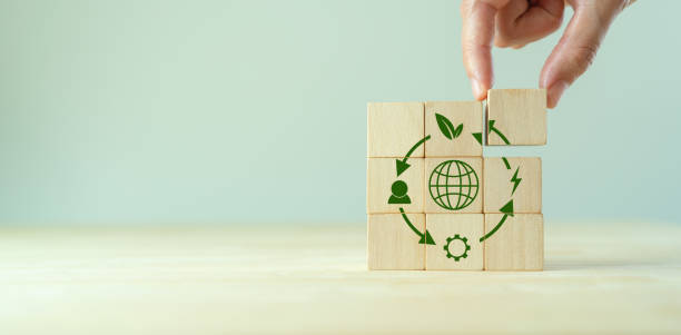Circular economy concept, recycle, environment, reuse, manufacturing, waste, consumer, resources. LCA Life cycle assessment. Sustainability Wooden cubes; symbol of circular economy on grey background. Circular economy concept, recycle, environment, reuse, manufacturing, waste, consumer, resources. LCA Life cycle assessment. Sustainability Wooden cubes; symbol of circular economy on grey background. larnaca international airport stock pictures, royalty-free photos & images