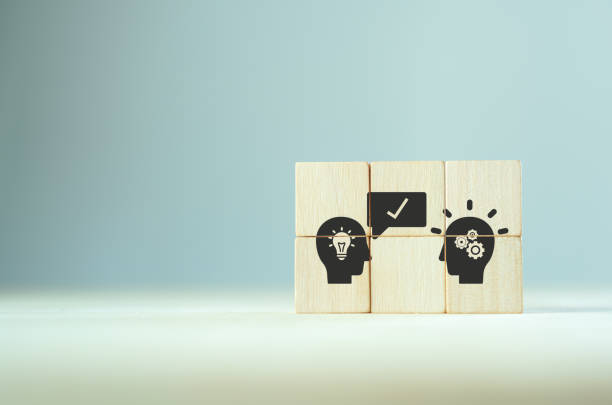 istock Suggestion and consulting concept.  
New idea, solution. Wooden cubes with personal recommend to advise someone icon on grey background. Business review, strategy suggestion for business developement. 1390406763