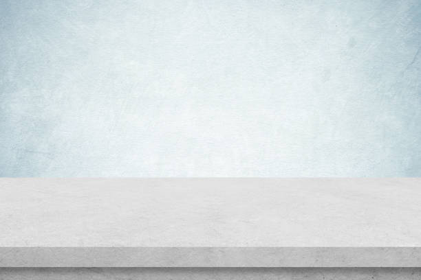 istock Empty white cement table over blue cement concrete wall background, banner, table top, shelf, counter design for product display montage 1390409564