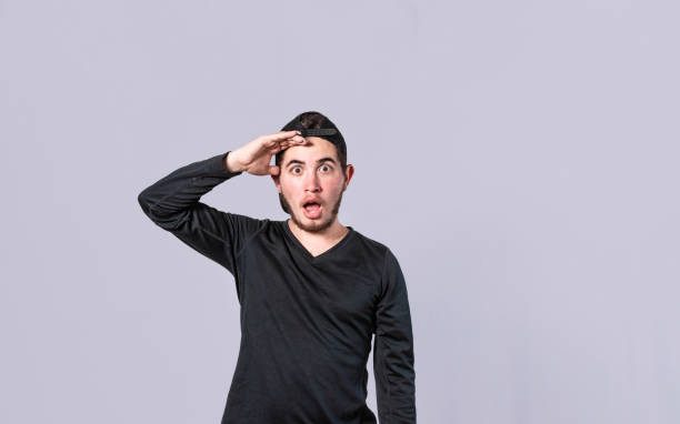 istock Amazed young man with his mouth open with his hand on his forehead, surprised guy with his mouth open with his hand on his forehead, concept of someone astonished 1390416301