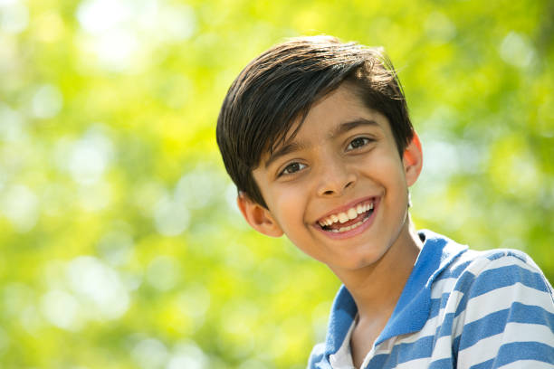 istock Joyful boy at the park 1390416625