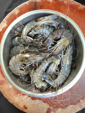 Fresh Shrimps in bowl - food preparation.