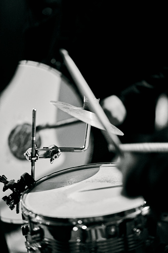close up of a drummer's hands playing a hand drum