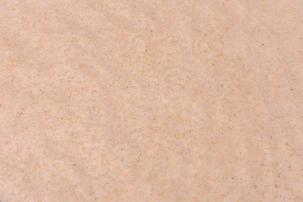 istock Rolled out prepared raw dough on parchment and baking sheet 1390428597