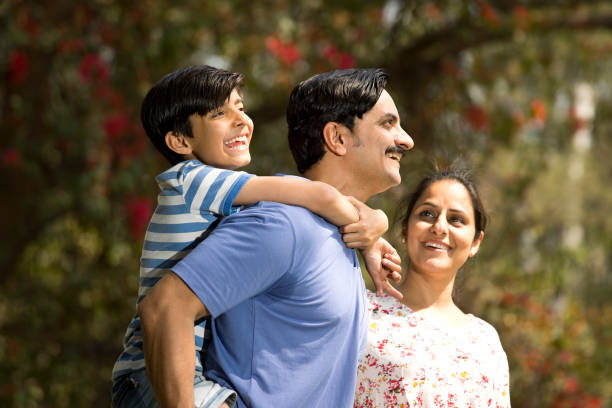 istock Happy family admiring view at park 1390429294