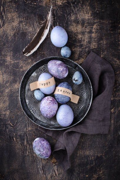 istock Festive Easter eggs in purple and blue color 1390433125