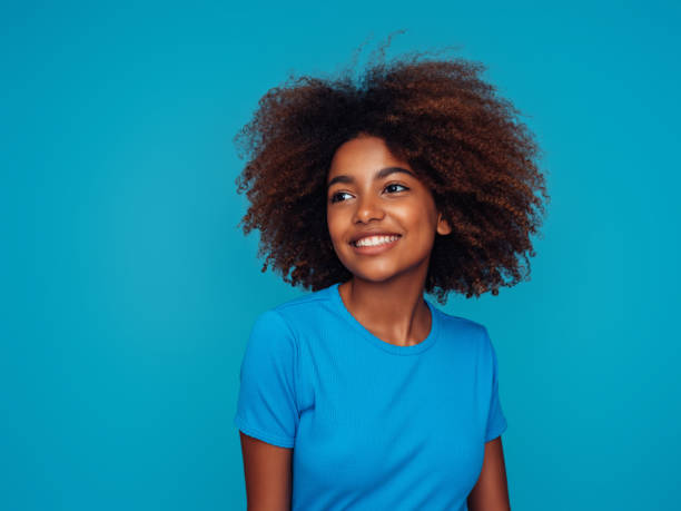 istock Beautiful girl with curly hairstyle 1390433388
