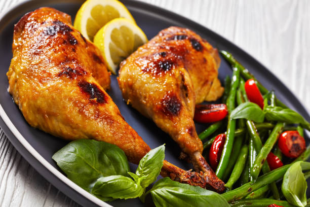 istock juicy roast chicken legs with green beans salad 1390433575