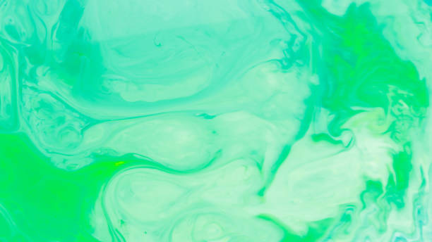 Abstract liquid ink painting texture. Turquoise trendy backdrop. Colorful chemical experiment