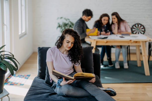 istock Group of students studying at home for their examand 1390440398