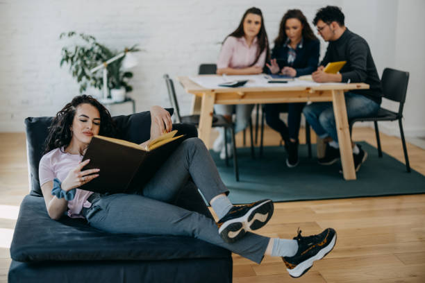 istock Group of students studying at home for their examand 1390440408
