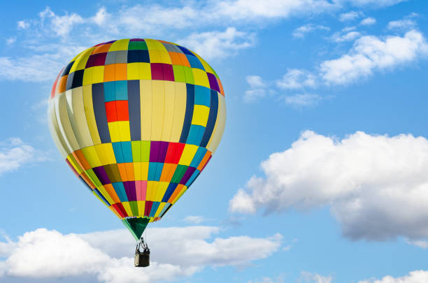 istock Hot air balloon flight over blue sky 1390443552