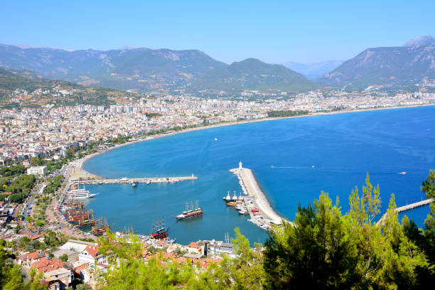istock seaport with lighthouse and ships, view from top of the mountain 1390449794