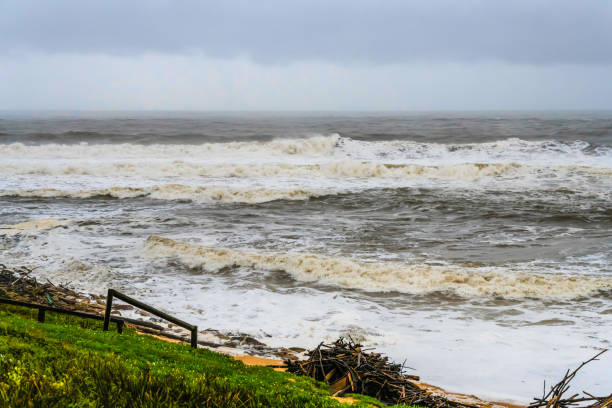 Large waves sweep into Copacabana Beach on the Central Coast, NSW, Australia.