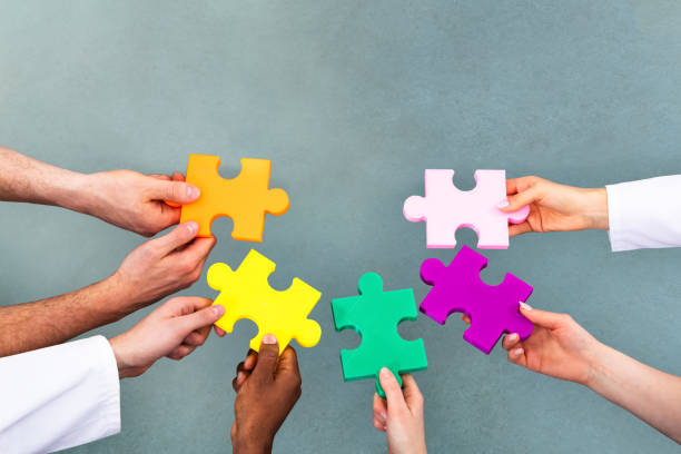 istock High Angle View Of Medical Team Solving Jigsaw Puzzle 1390449948