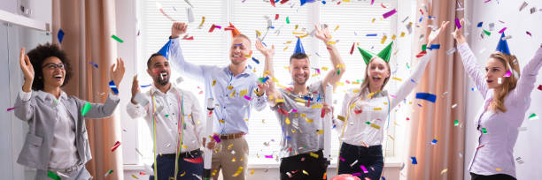 istock Excited Businesspeople Having Fun Raising Their Arms 1390450647