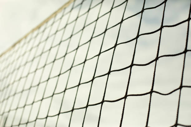 istock Sports net. Volleyball equipment. Grid against sky. 1390451049