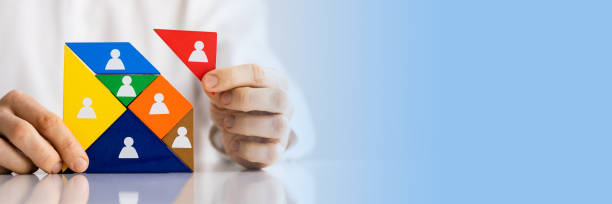 istock HR Recruitment Hand Making Tangram Puzzle 1390452344
