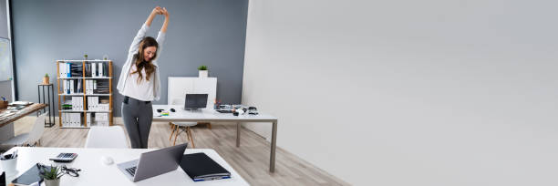 istock Businesswoman Stretching At Desk 1390452538