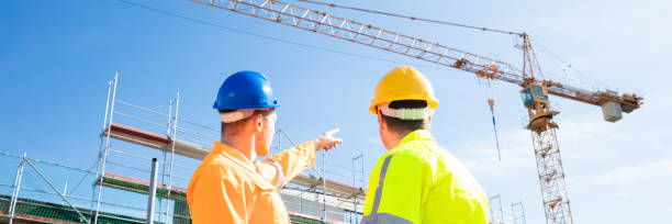 istock Two Male Engineers Supervising The Construction Site 1390452593