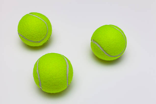 istock tennis ball lies on a white background 1390452911