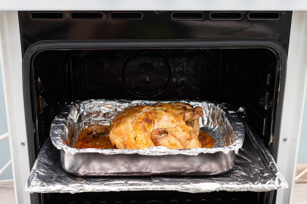 istock fried chicken carcass lies on a tray in an open oven 1390453827
