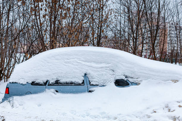 istock passenger car completely covered with snow after a snowfall 1390454048