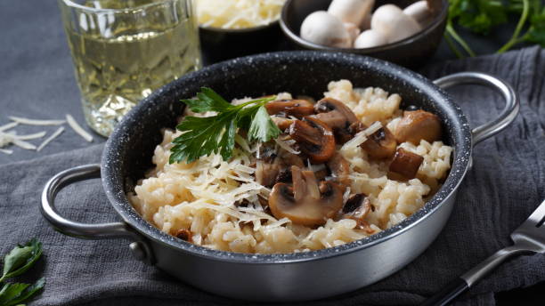 istock Mushroom risotto garnished with parsley  and parmesan. 1390454089