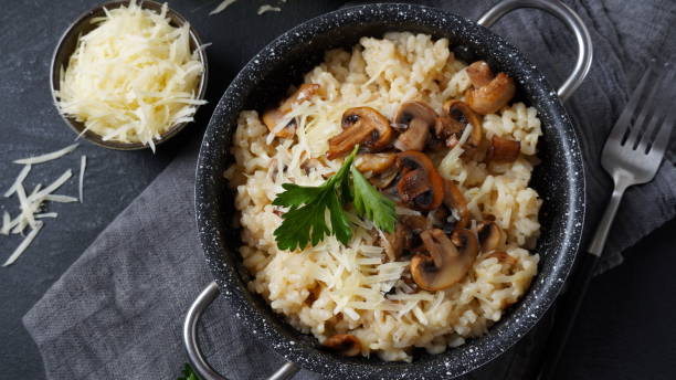 istock Mushroom risotto garnished with parsley  and parmesan. 1390454092