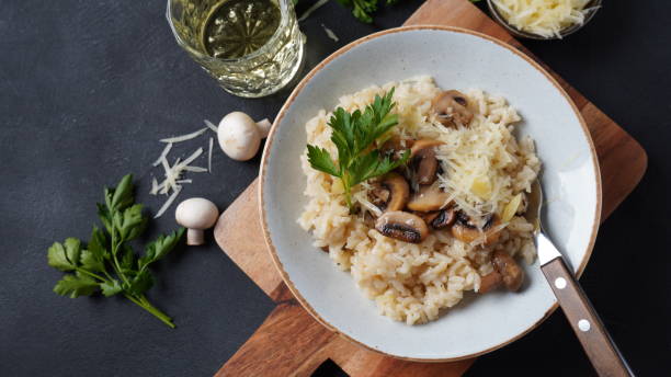 istock Mushroom risotto garnished with parsley  and parmesan. 1390454118