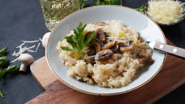 istock Mushroom risotto garnished with parsley  and parmesan. 1390454120
