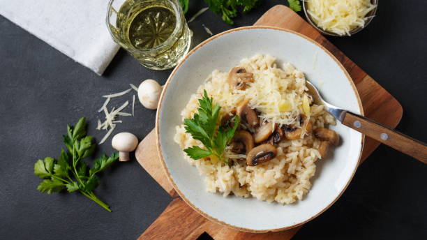 istock Mushroom risotto garnished with parsley  and parmesan. 1390454124