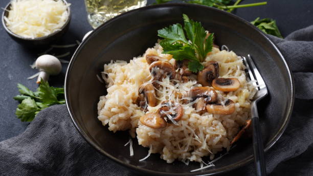 istock Mushroom risotto garnished with parsley  and parmesan. 1390454141