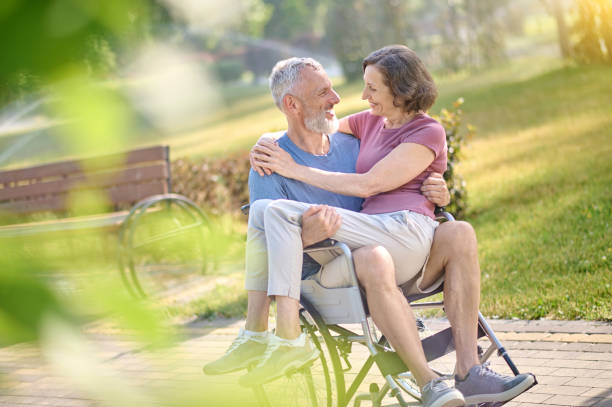 istock A couple in the park looking happy and romantic 1390455102