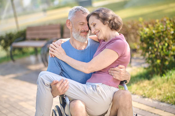 istock A couple in the park looking happy and romantic 1390455108