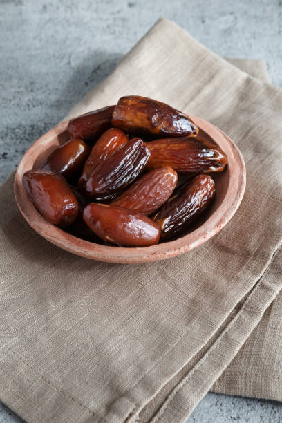 istock Algerian dates deglet nour on a light background in a bowl 1390456650