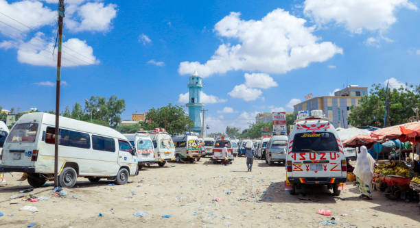 White Minibuses Station on the Hargeisa streets Hargeisa, Somaliland - November 10, 2019: White Minibuses Station on the Hargeisa streets hargeysa photos stock pictures, royalty-free photos & images