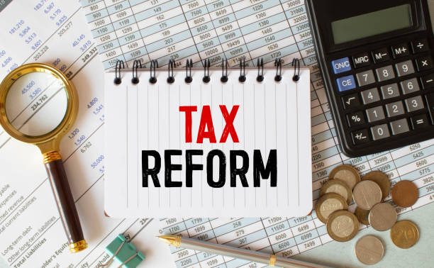 istock White notepad text TAX REFORM with diagram,chart,calculator on white background 1390466031