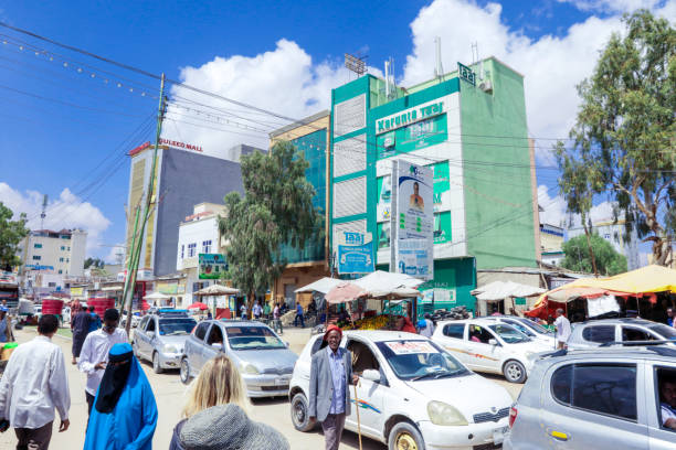 White Taxi Cars and Local Buildings on the Hargeisa streets Hargeisa, Somaliland - November 10, 2019: White Taxi Cars and Local Buildings on the Hargeisa streets hargeysa photos stock pictures, royalty-free photos & images